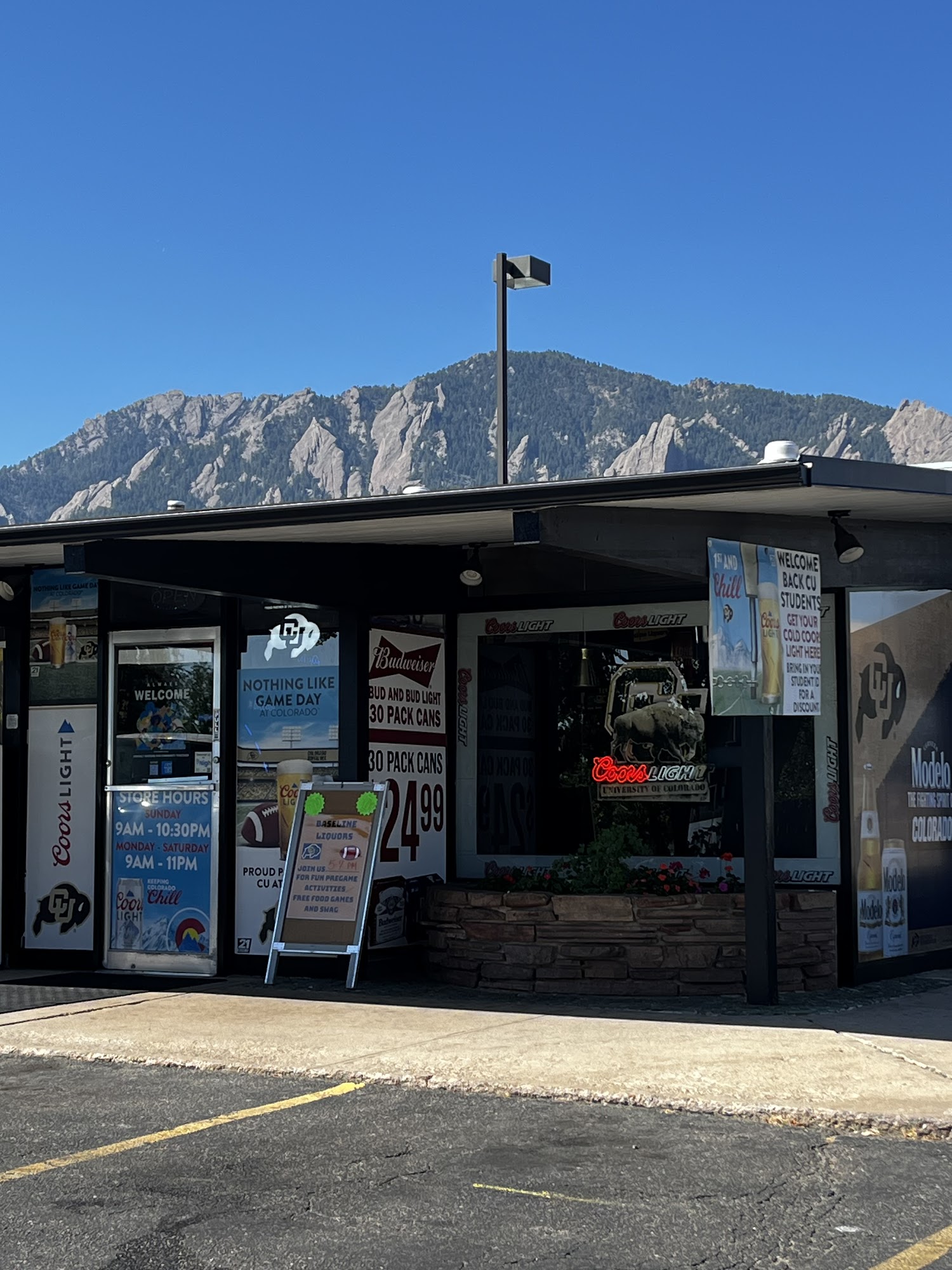 Baseline Liquors storefront with the Flatirons mountains behind